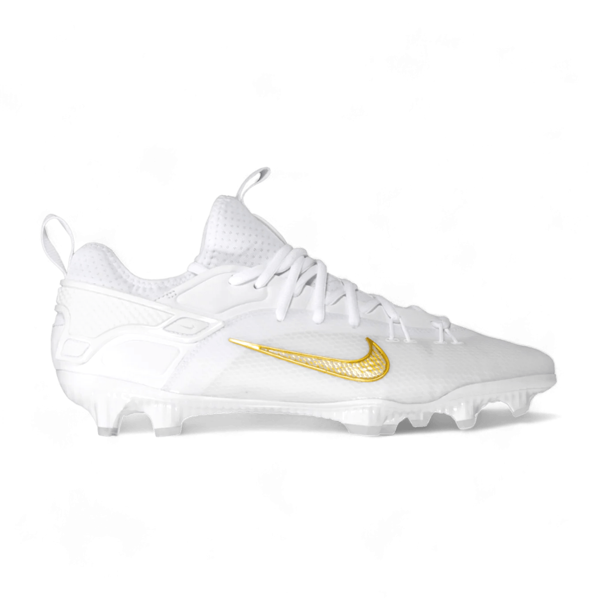 The Nike Alpha Huarache 9 Elite Low Cleats, in white, proudly display a gold swoosh logo and feature a textured upper design with studs on the sole, expertly combining performance and style.